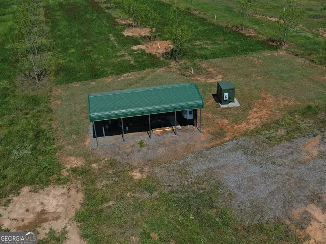 a view of a lake with a house in the background