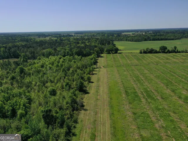 a view of a lake with a yard