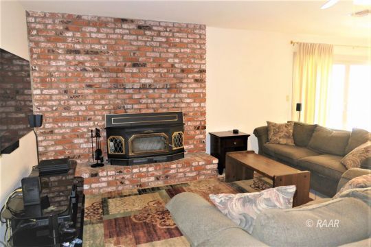 908 Randall Street Ridgecrest, CA 93555 - Photo 14 of 35 a living room with furniture and a fireplace