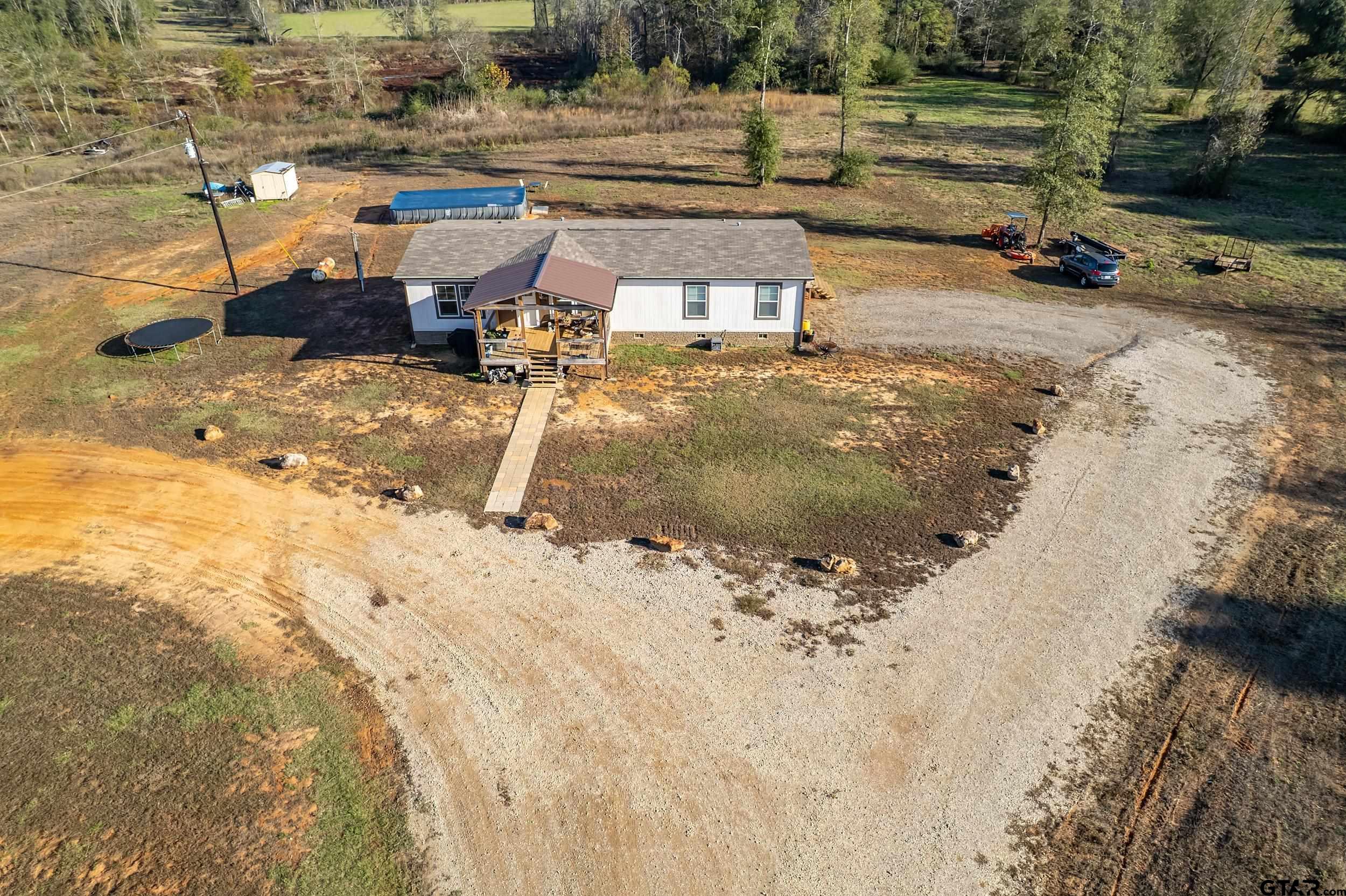 a view of a backyard of the house