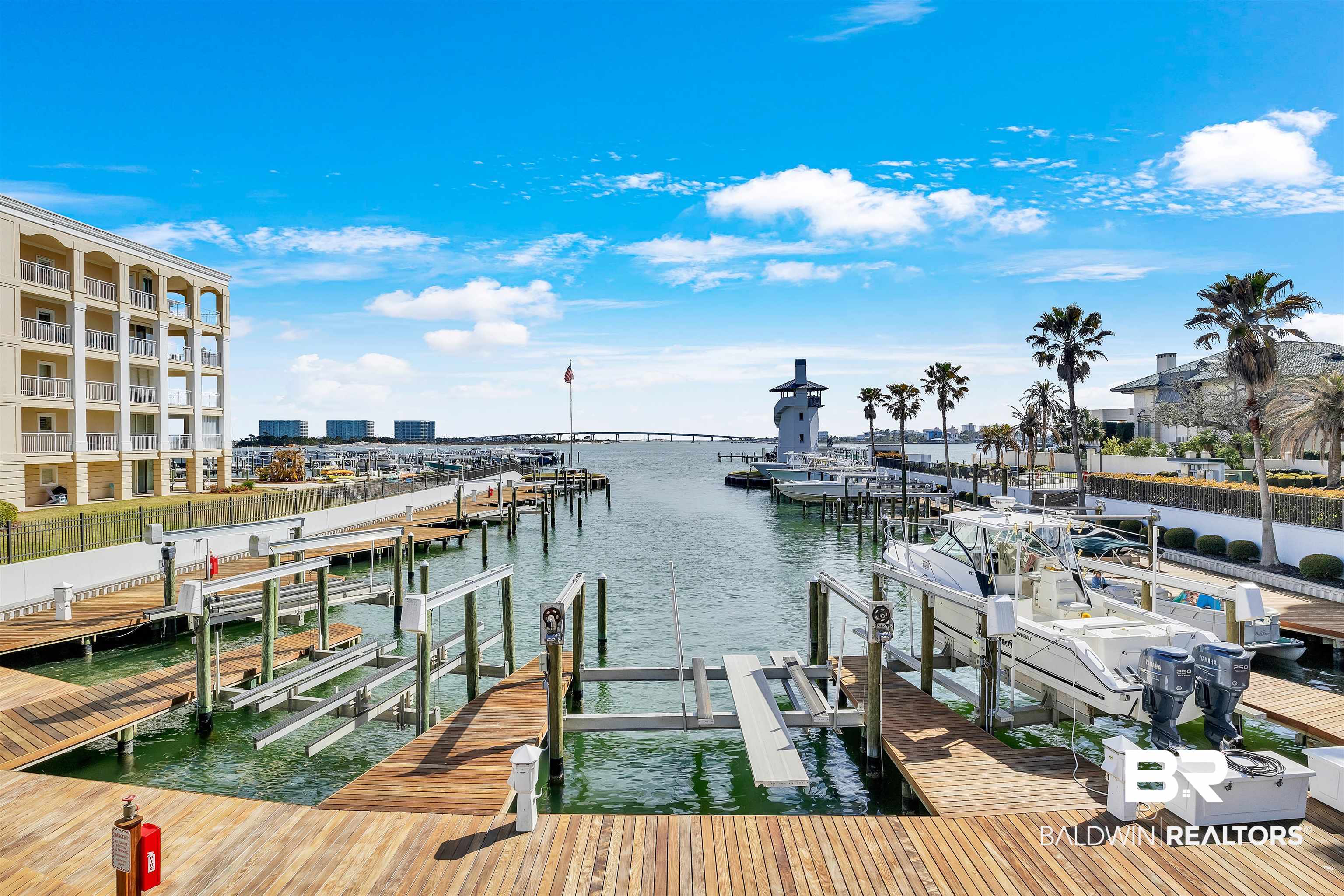 27582 Canal Road, Unit 2605 Orange Beach, AL 36561 - Photo 32 of 41 Dock with boat lift and a water view