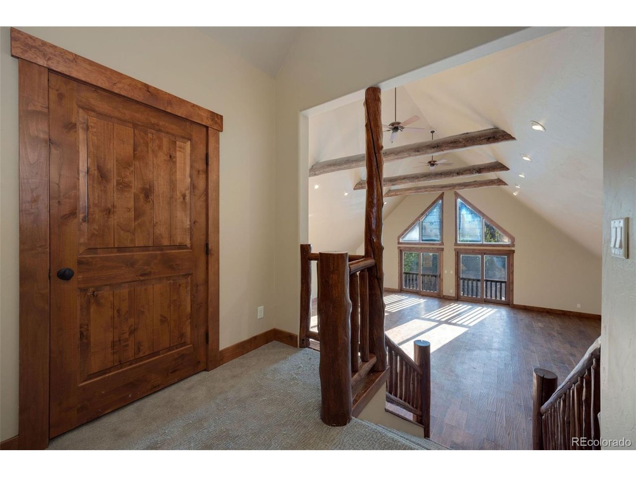 5200 Jackson Road Walden, CO 80480 - Photo 24 of 40 View from above the stairs of the large great-room
