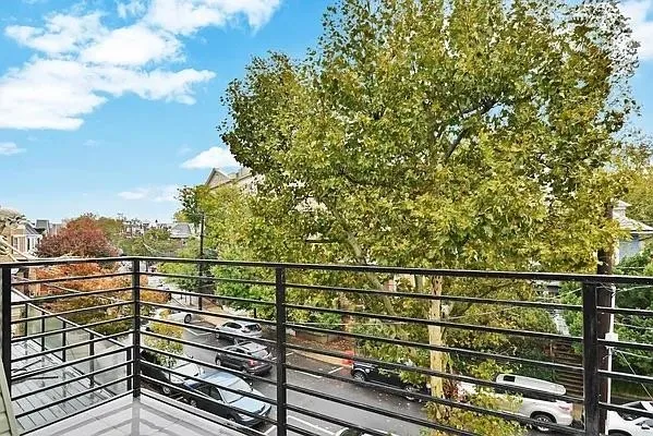 a view of a balcony with a pot