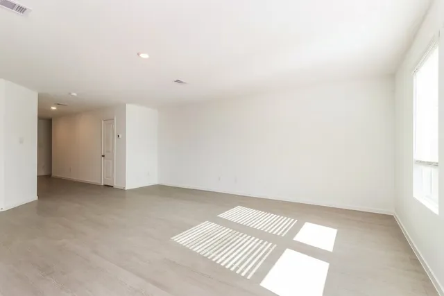 a view of a kitchen with microwave and cabinets