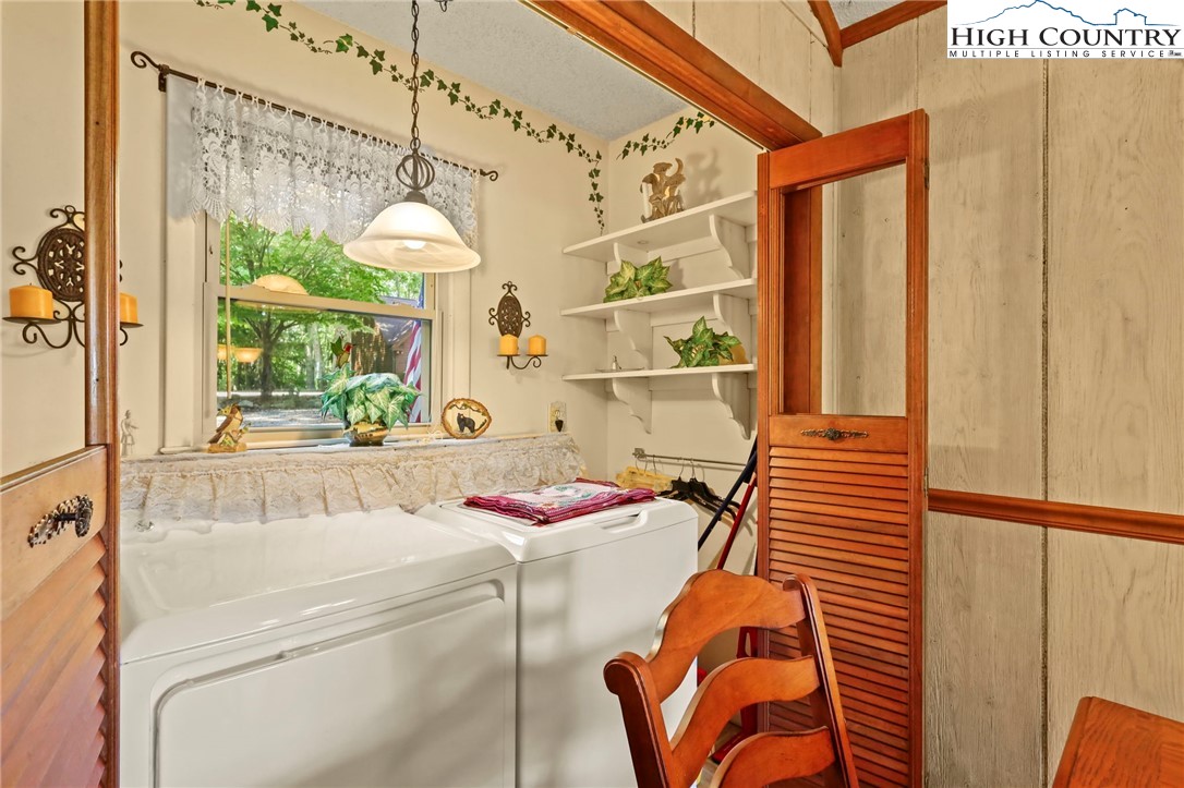 714 Pine Ridge Road Beech Mountain, NC 28604 - Photo 24 of 27 a bathroom with a sink and a mirror