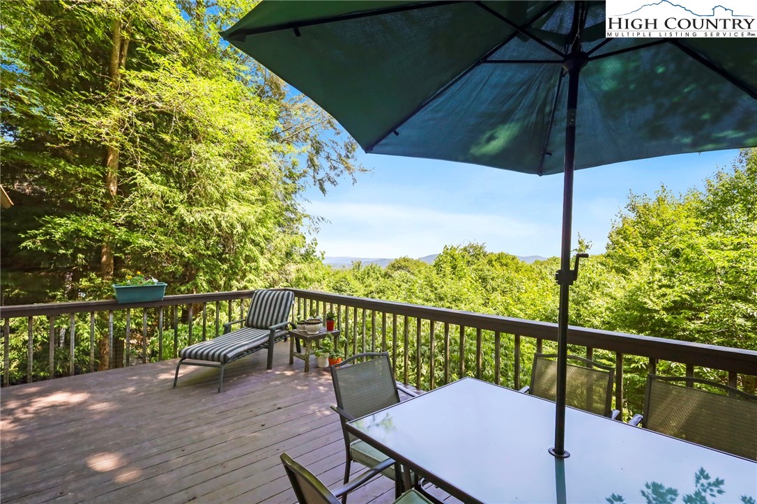 714 Pine Ridge Road Beech Mountain, NC 28604 - Photo 25 of 27 a view of a balcony with furniture