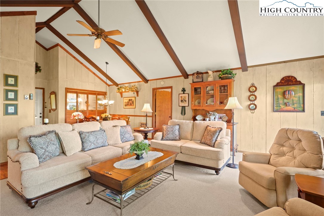 714 Pine Ridge Road Beech Mountain, NC 28604 - Photo 5 of 27 a living room with furniture and a large window