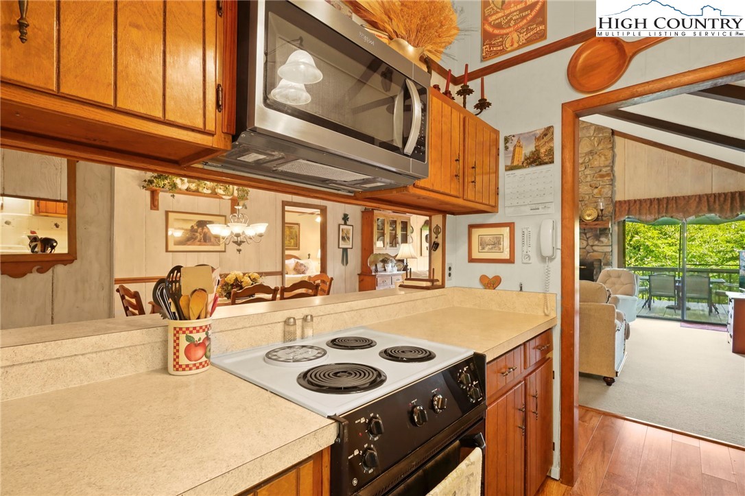 714 Pine Ridge Road Beech Mountain, NC 28604 - Photo 9 of 27 a kitchen view with a stove and a refrigerator