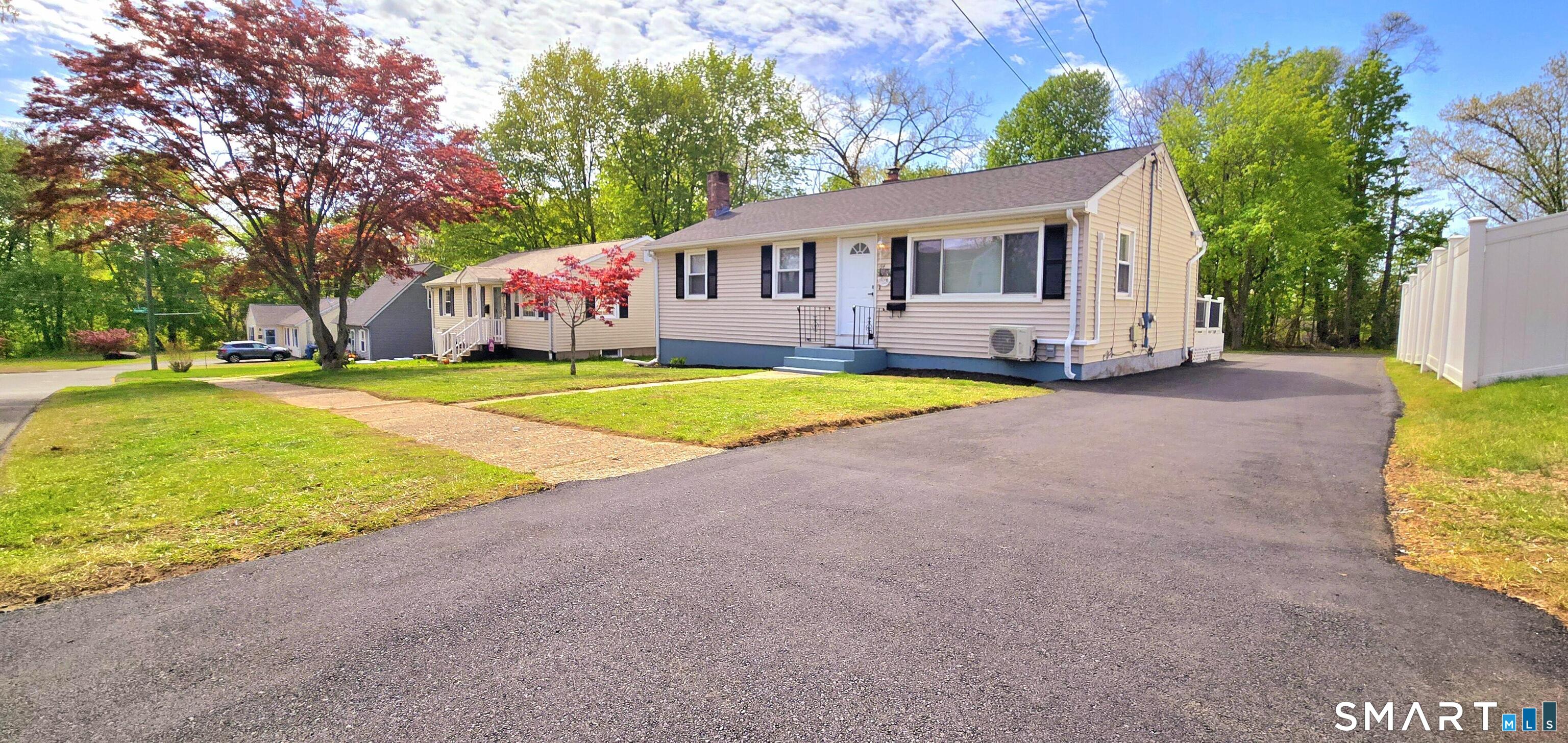 a house with swimming pool in front of it