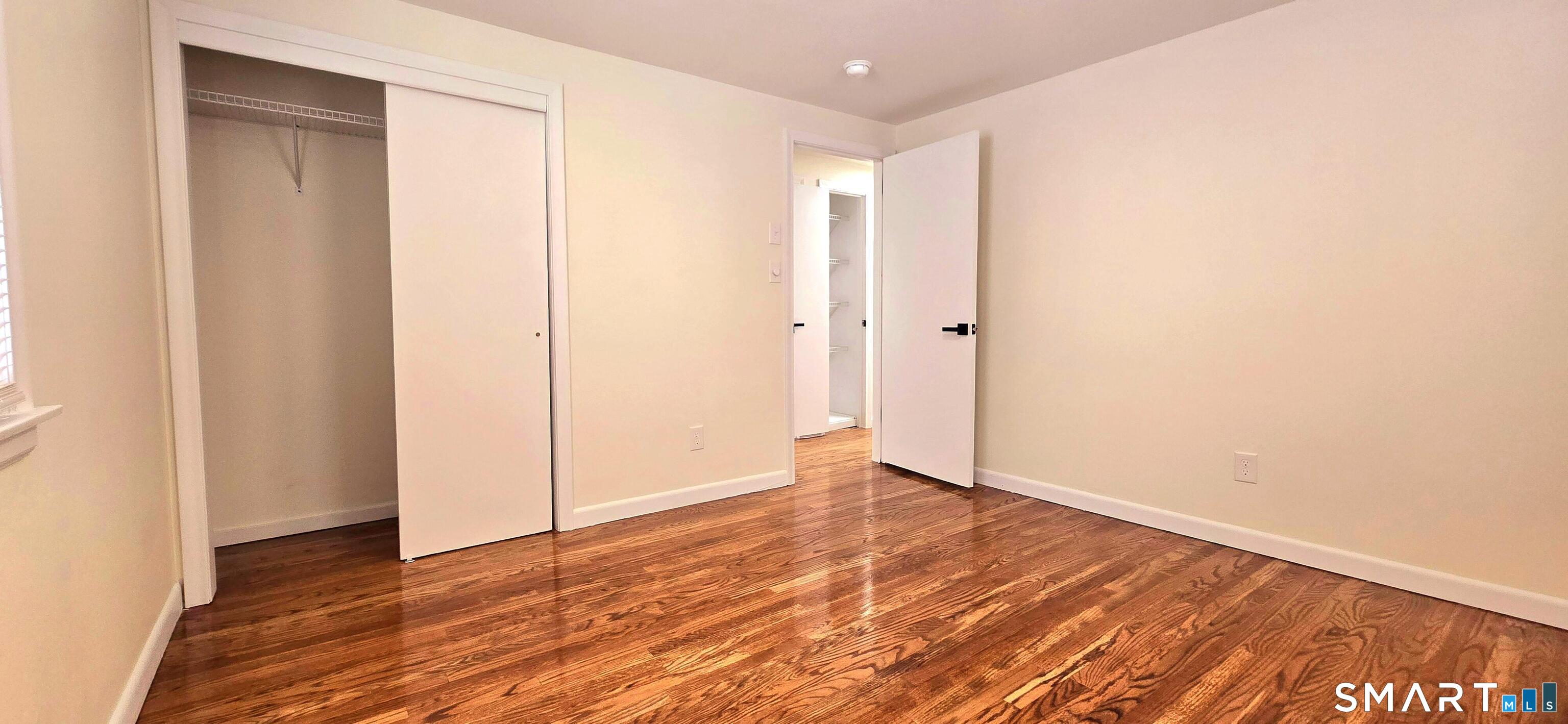 64 4th Street Bristol, CT 06010 - Photo 13 of 44 a view of an empty room with wooden floor