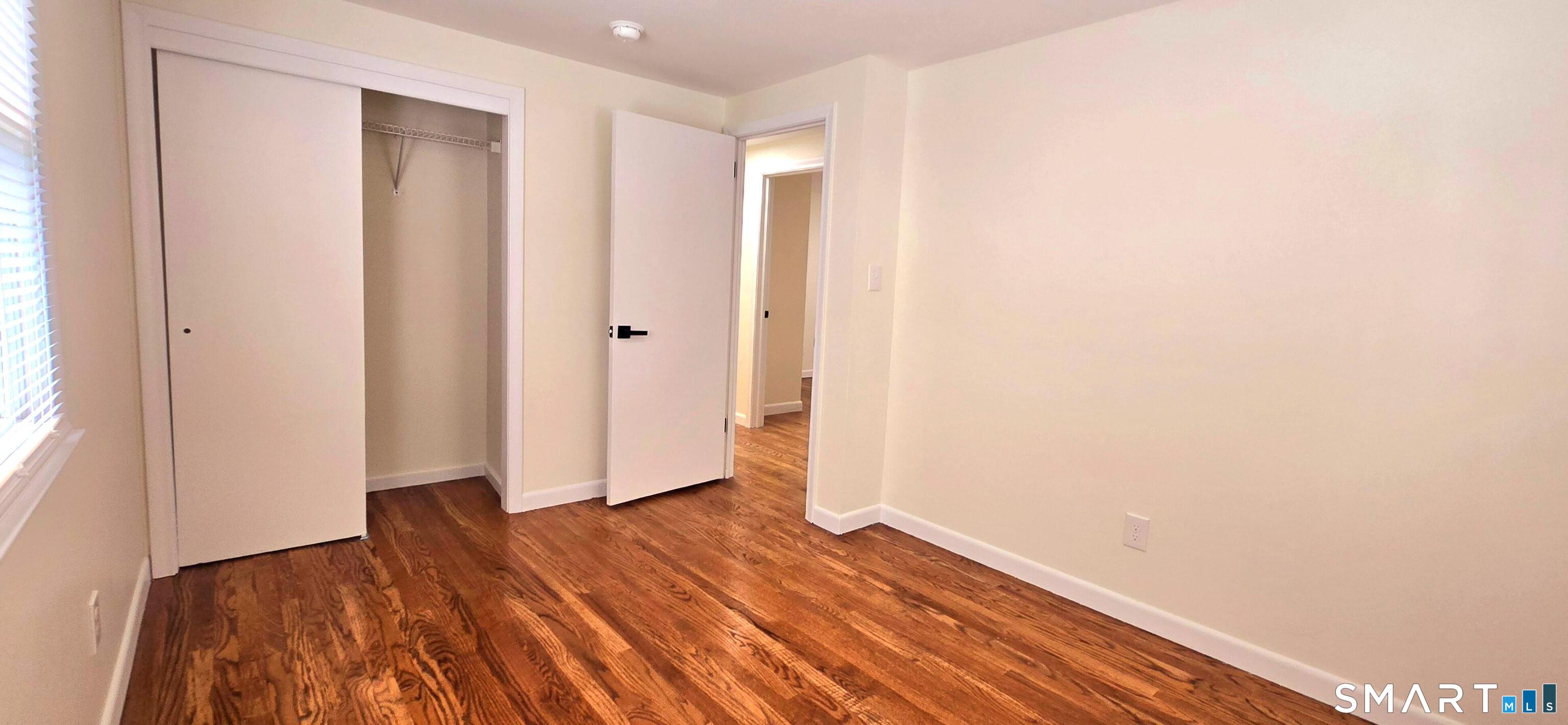 64 4th Street Bristol, CT 06010 - Photo 15 of 44 a view of hallway with wooden floor