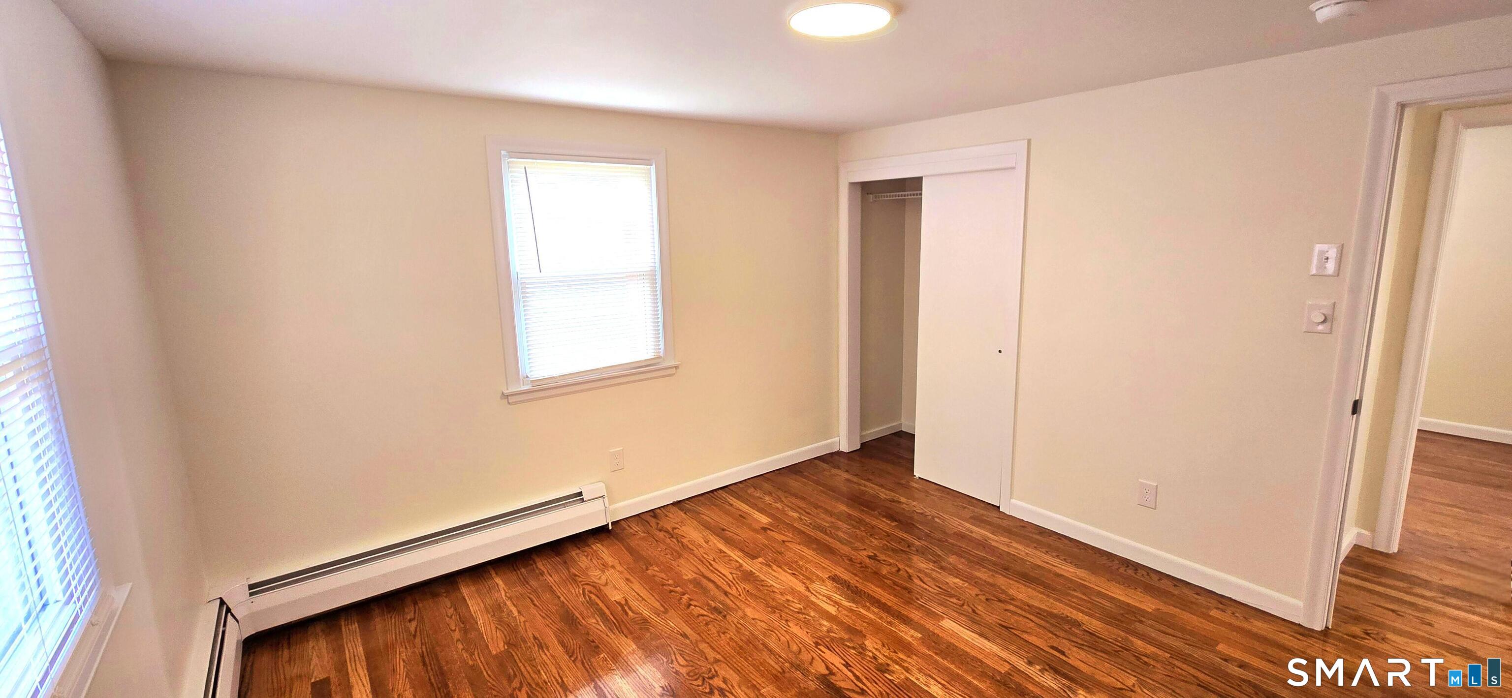 64 4th Street Bristol, CT 06010 - Photo 17 of 44 a view of an empty room and window