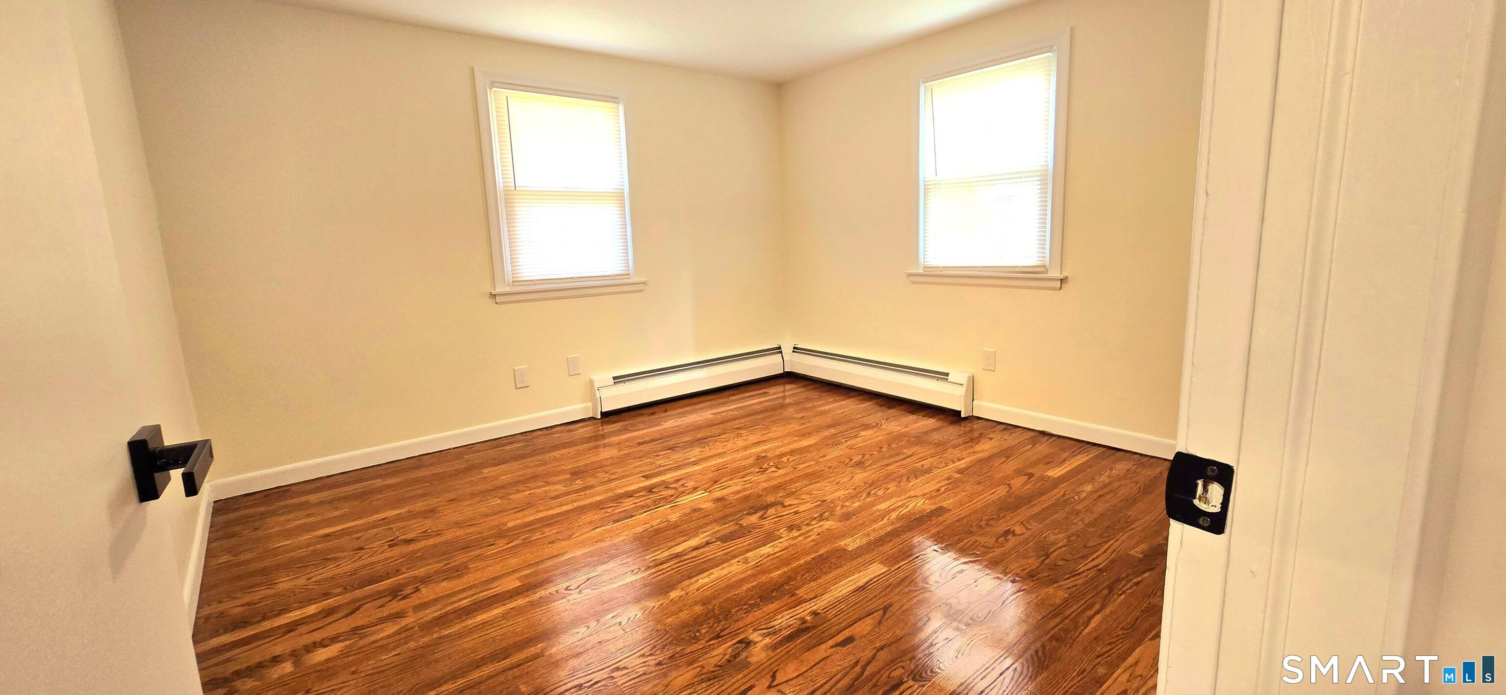 64 4th Street Bristol, CT 06010 - Photo 18 of 44 a view of a room with wooden floor and a window