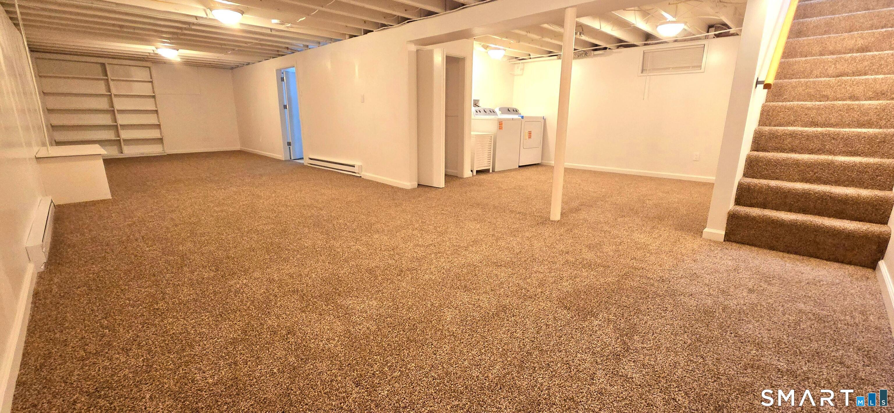 64 4th Street Bristol, CT 06010 - Photo 24 of 44 a view of a room with stairs and a large window