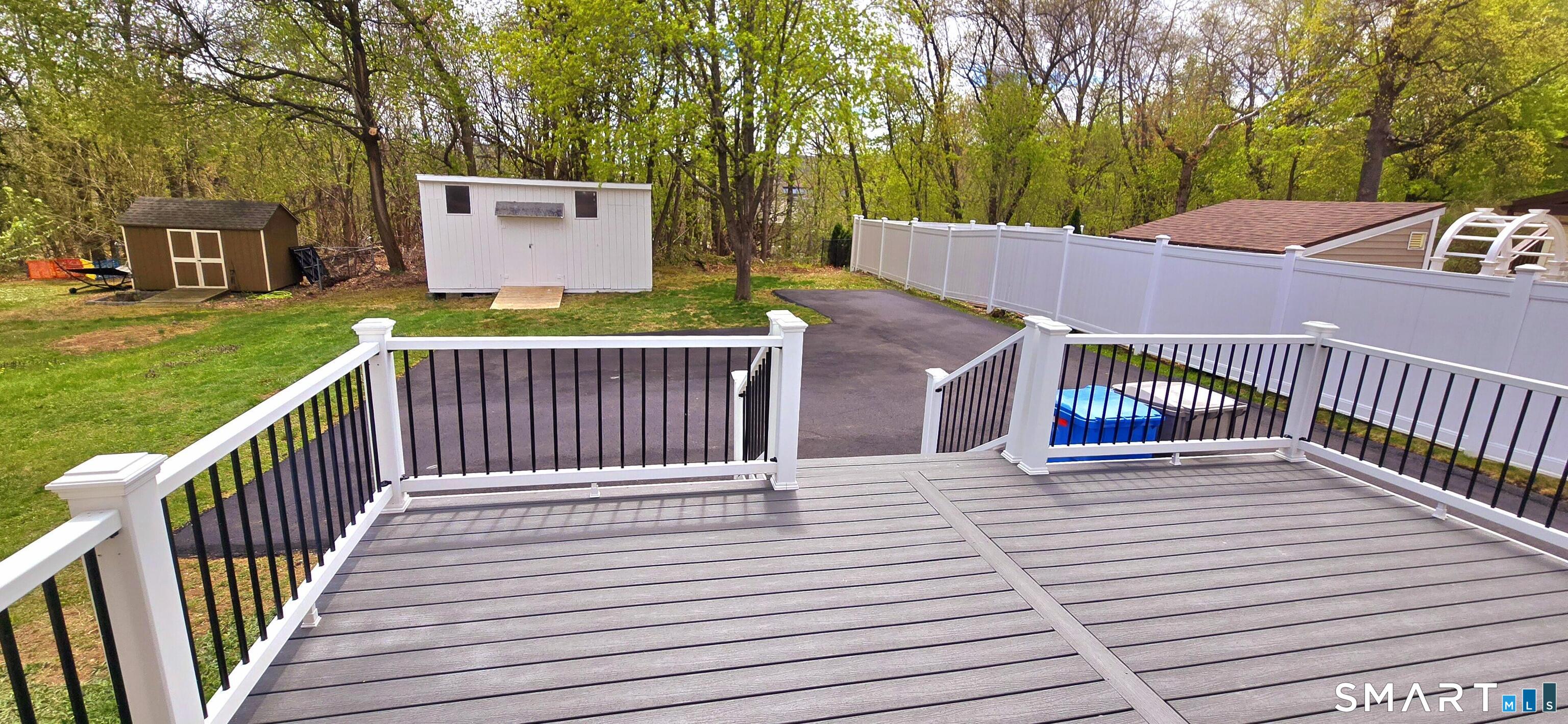 64 4th Street Bristol, CT 06010 - Photo 33 of 44 a view of a wooden deck and a yard