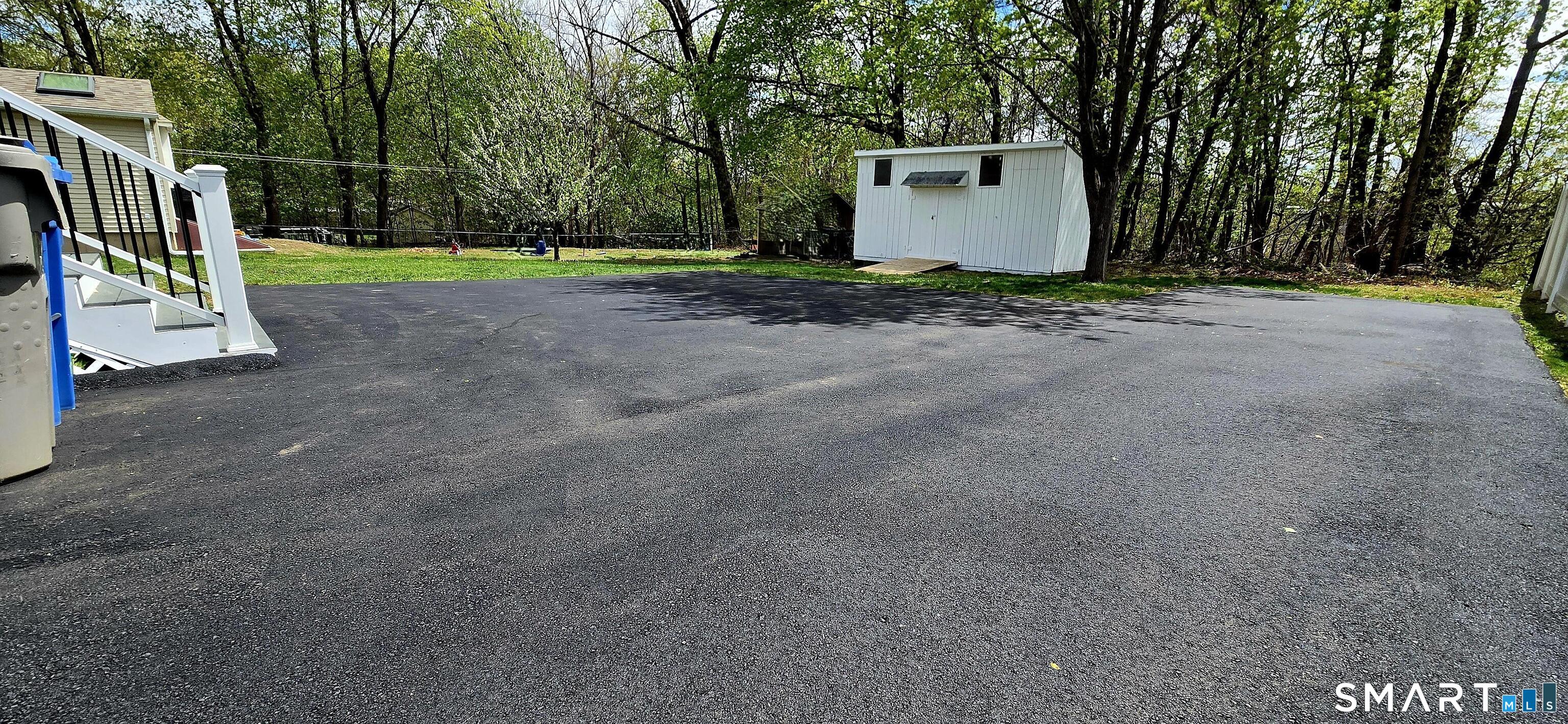 64 4th Street Bristol, CT 06010 - Photo 39 of 44 a view of a backyard with a trees