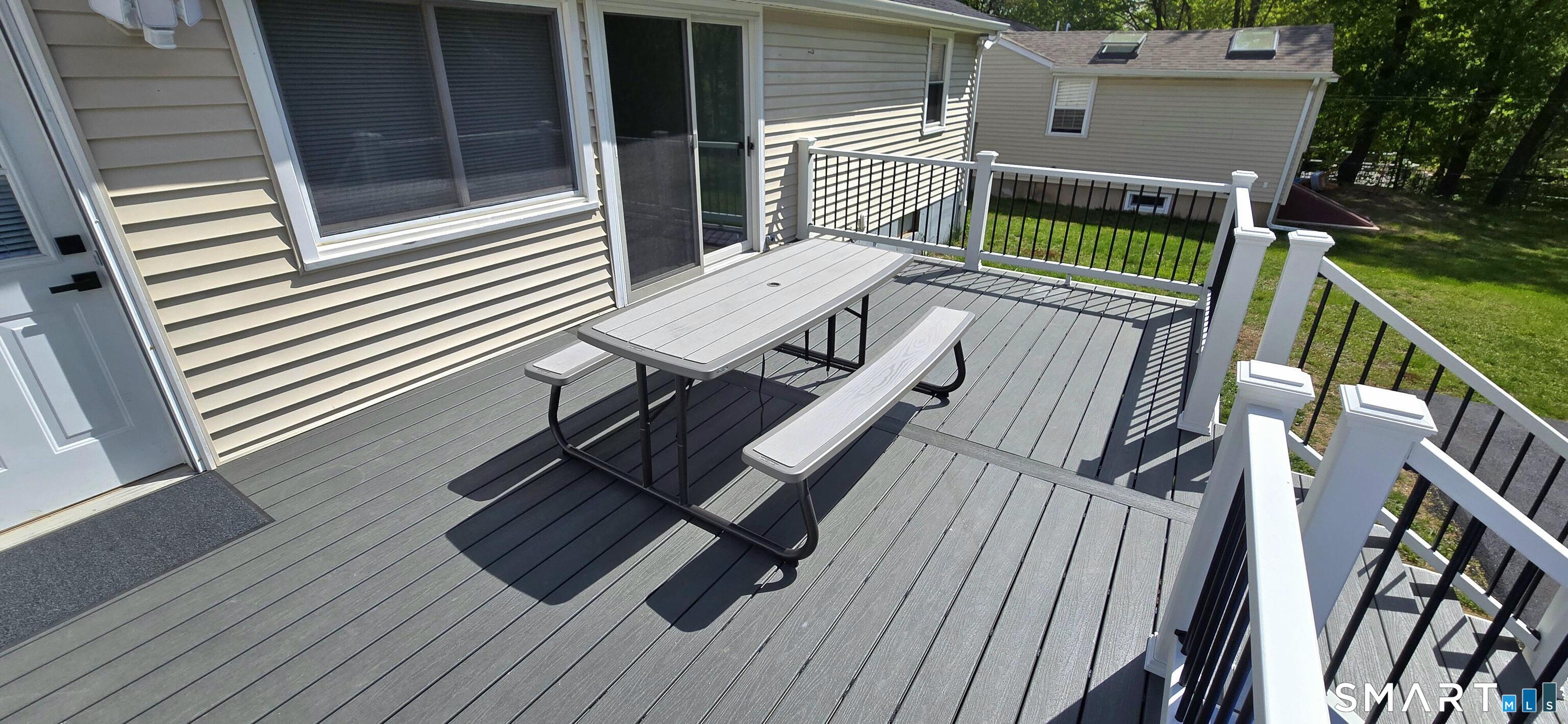 64 4th Street Bristol, CT 06010 - Photo 43 of 44 a balcony with wooden floor table and chairs