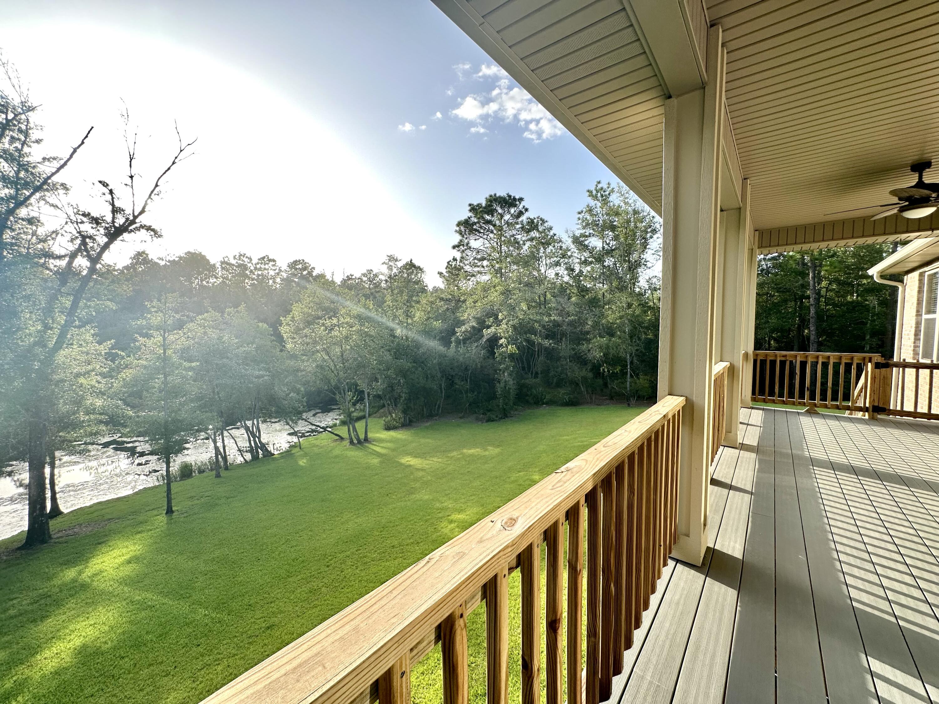 1207 Tallokas Road Crestview, FL 32536 - Photo 12 of 58 a view of a balcony with yard