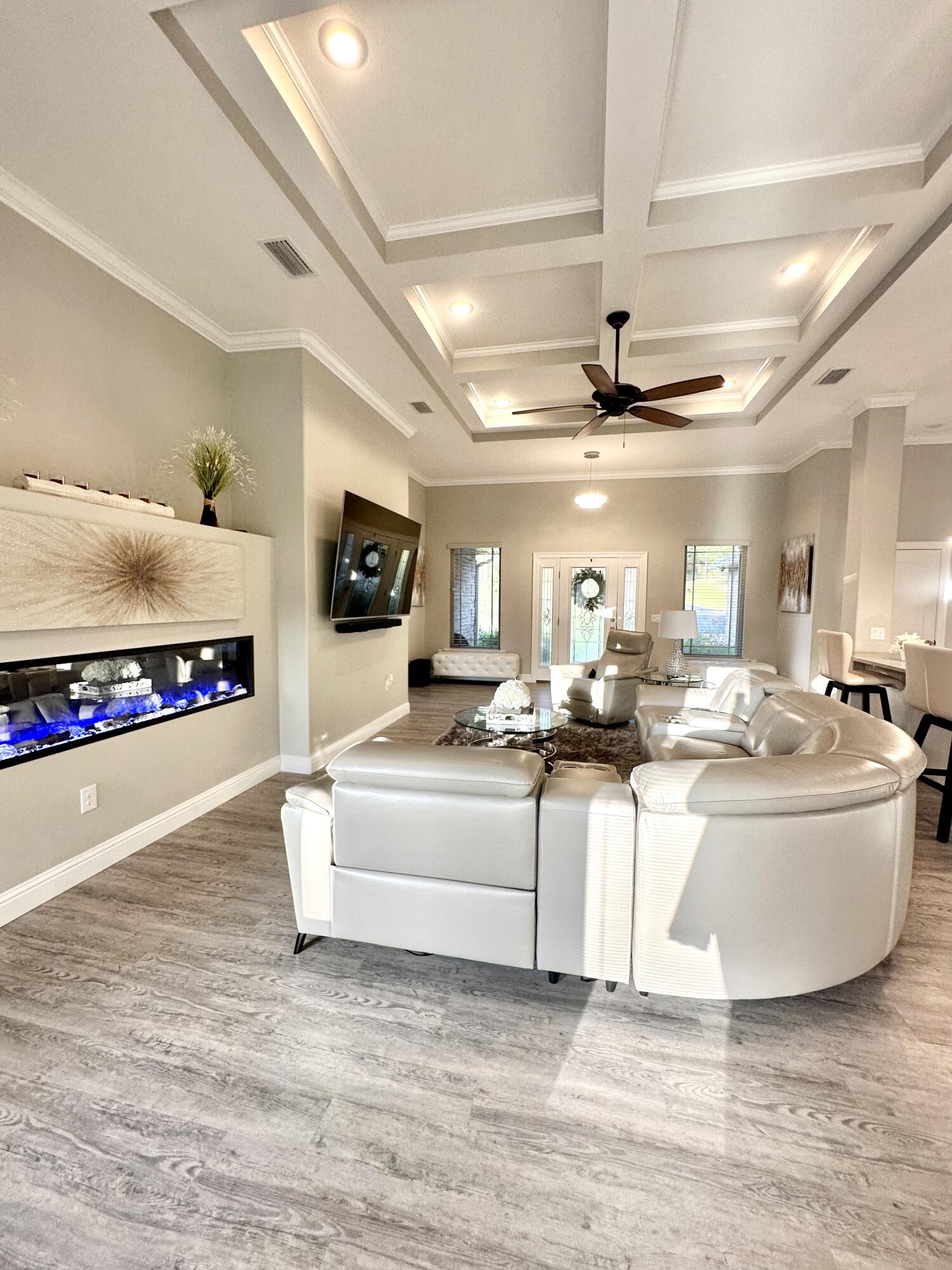 1207 Tallokas Road Crestview, FL 32536 - Photo 16 of 58 a living room with furniture and a flat screen tv