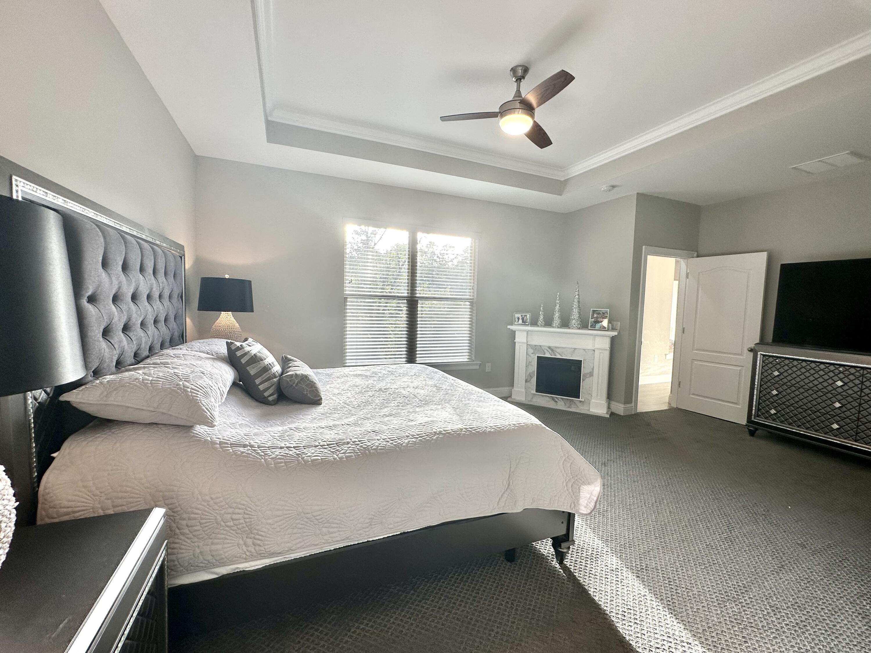 1207 Tallokas Road Crestview, FL 32536 - Photo 28 of 58 a bed room with a bed and a television