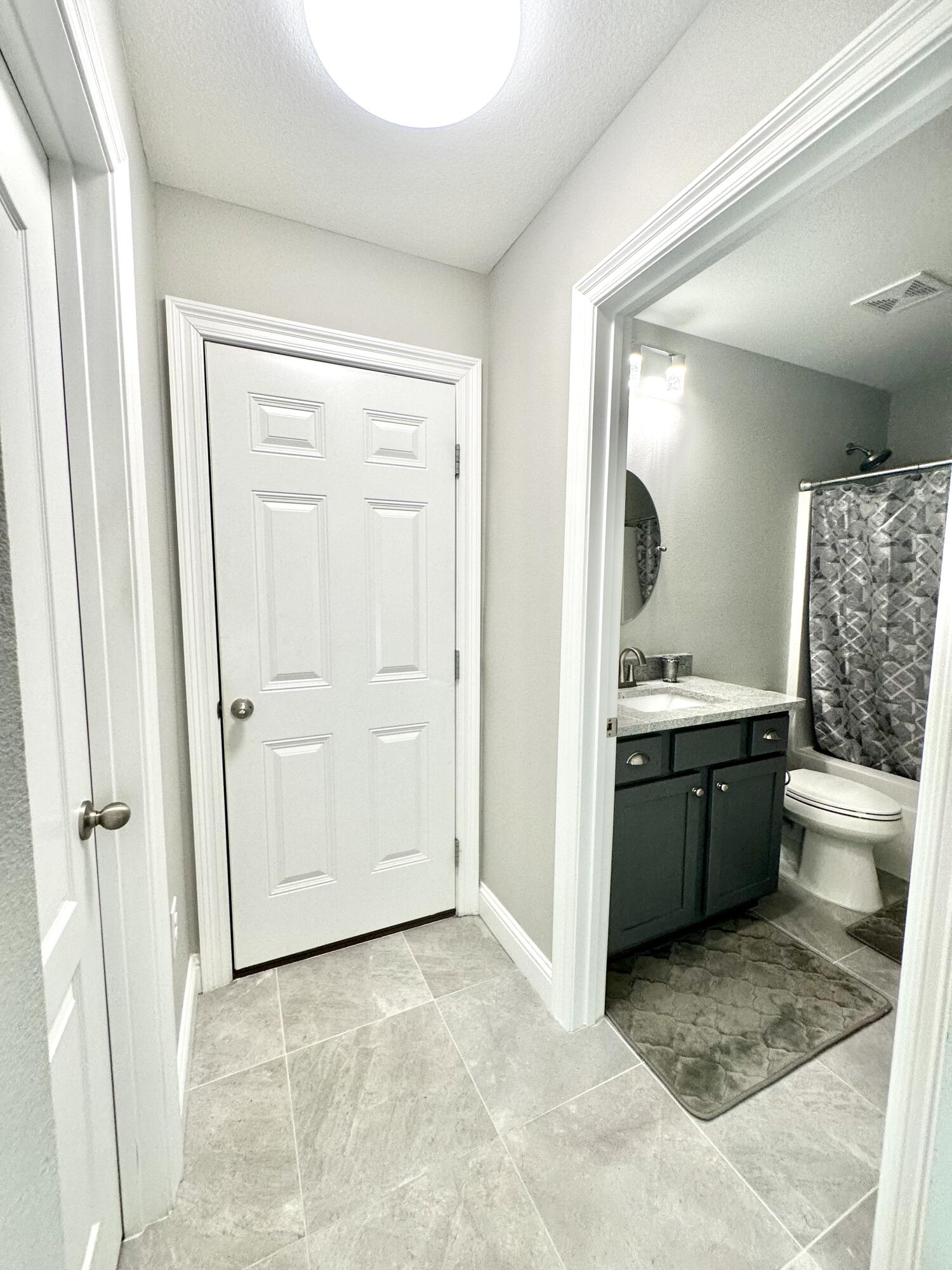 1207 Tallokas Road Crestview, FL 32536 - Photo 51 of 58 a bathroom with a granite countertop sink toilet and shower