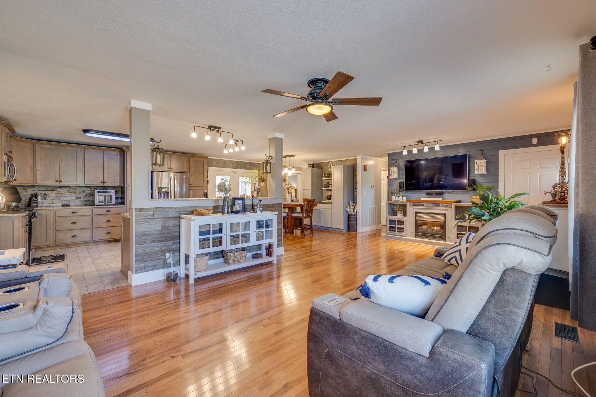 120 Rench Road Kingston, TN 37763 - Photo 3 of 21 a living room with furniture kitchen view and a wooden floor