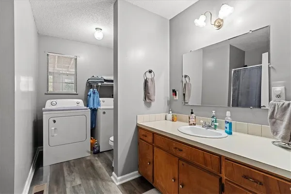 a bathroom with a sink double vanity and a mirror