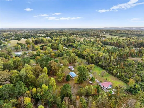an aerial view of residential building with green space