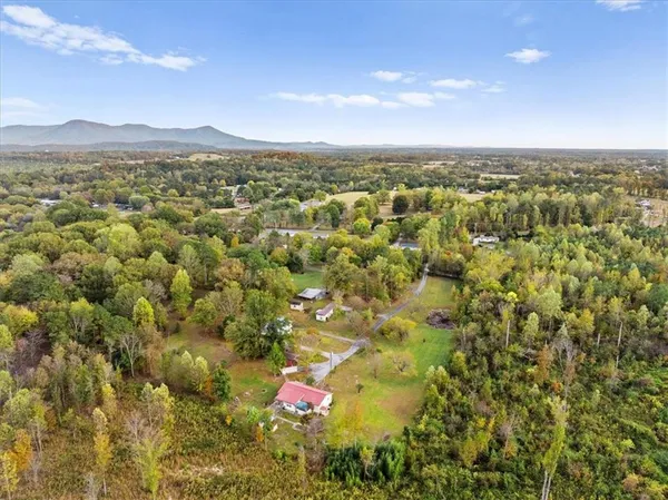 a view of a yard with swimming pool and sitting area