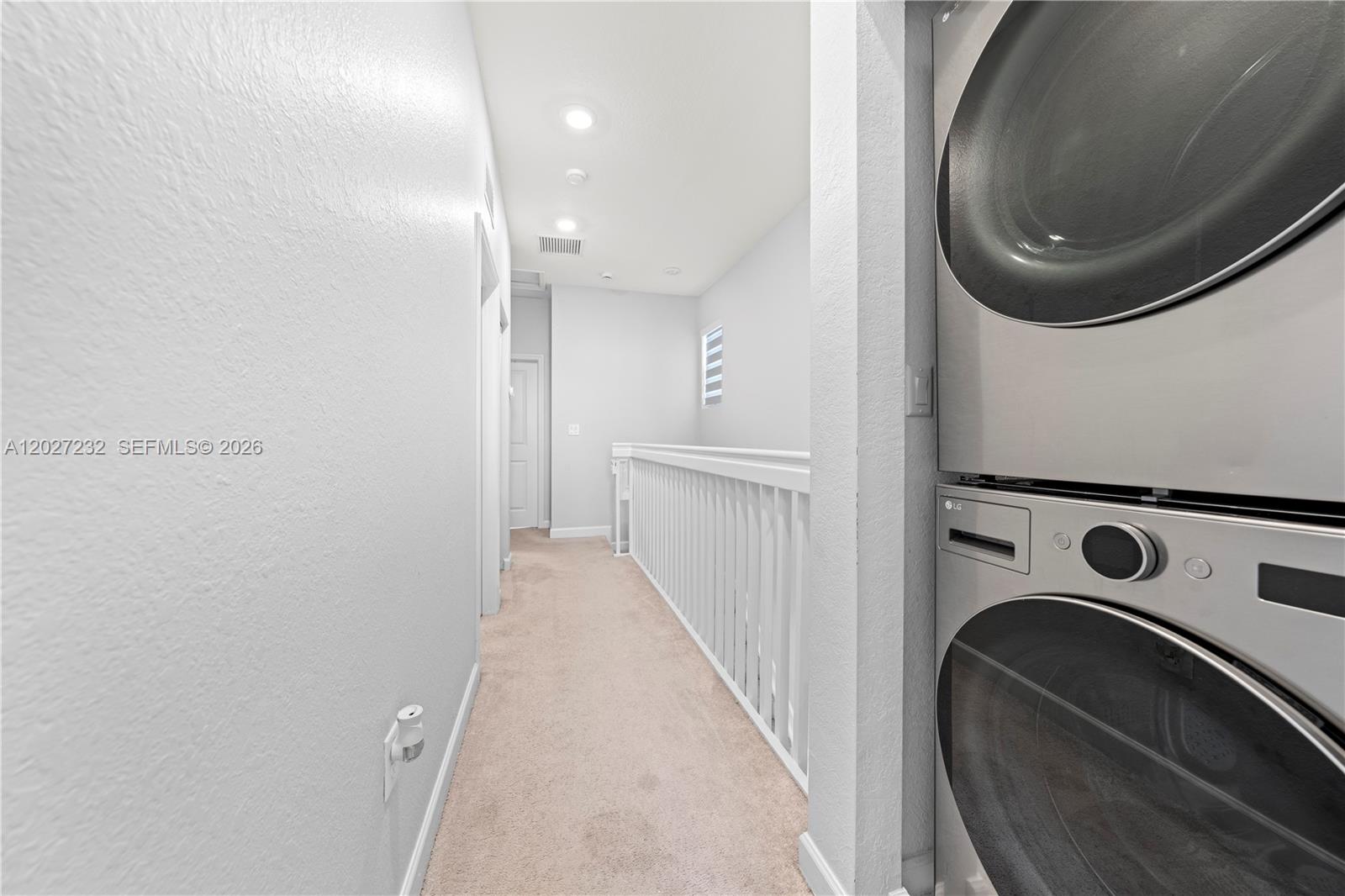 23489 Southwest 127th Place Homestead, FL 33032 - Photo 18 of 24 a view of a hallway with washer and dryer