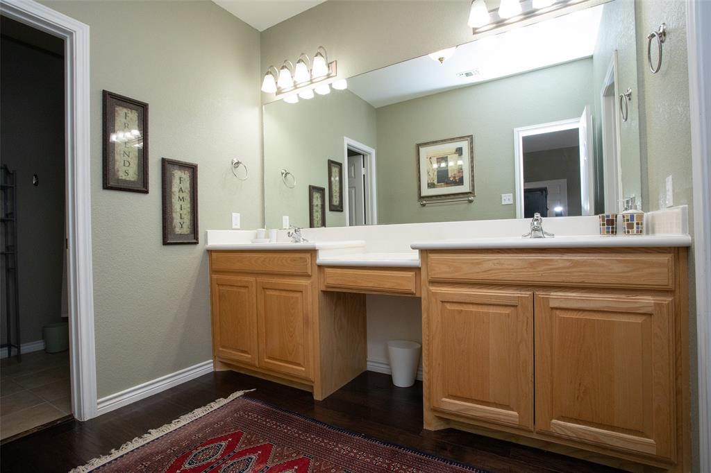 1204 Eagle Point Road Graford, TX 76449 - Photo 15 of 30 a bathroom with a sink and a mirror