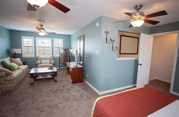 a bedroom with furniture and a chandelier