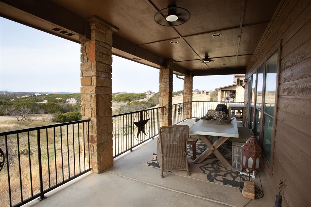1204 Eagle Point Road Graford, TX 76449 - Photo 20 of 30 a view of a chairs and table in the balcony