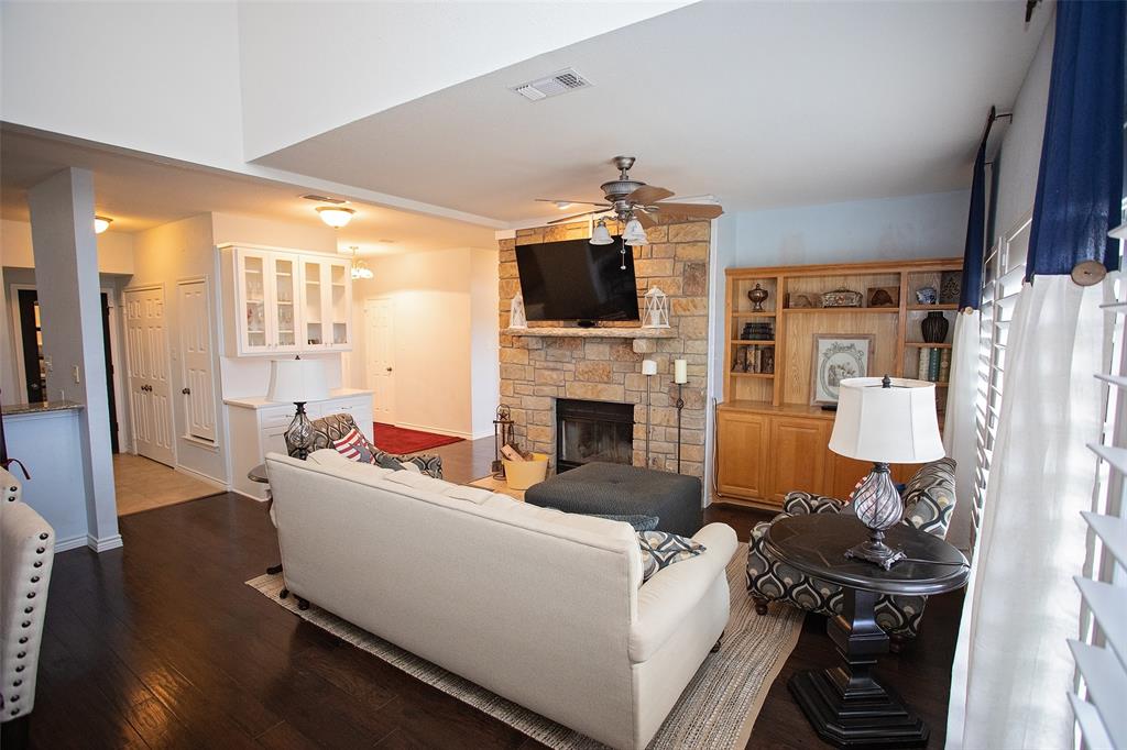 1204 Eagle Point Road Graford, TX 76449 - Photo 5 of 30 a living room with furniture a flat screen tv and a fireplace