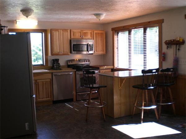 698 Town Farm Road Warren, MA 01083 - Photo 15 of 19 a kitchen with a sink a window stainless steel appliances and cabinets