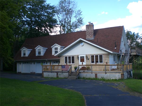 698 Town Farm Road Warren, MA 01083 - Photo 4 of 19 a front view of a house with a garden and yard