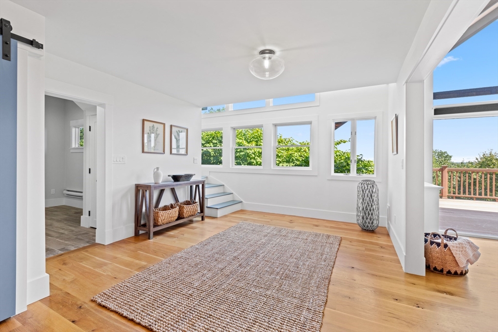 56 Hill Top Road Gloucester, MA 01930 - Photo 11 of 35 a living room with furniture and a table