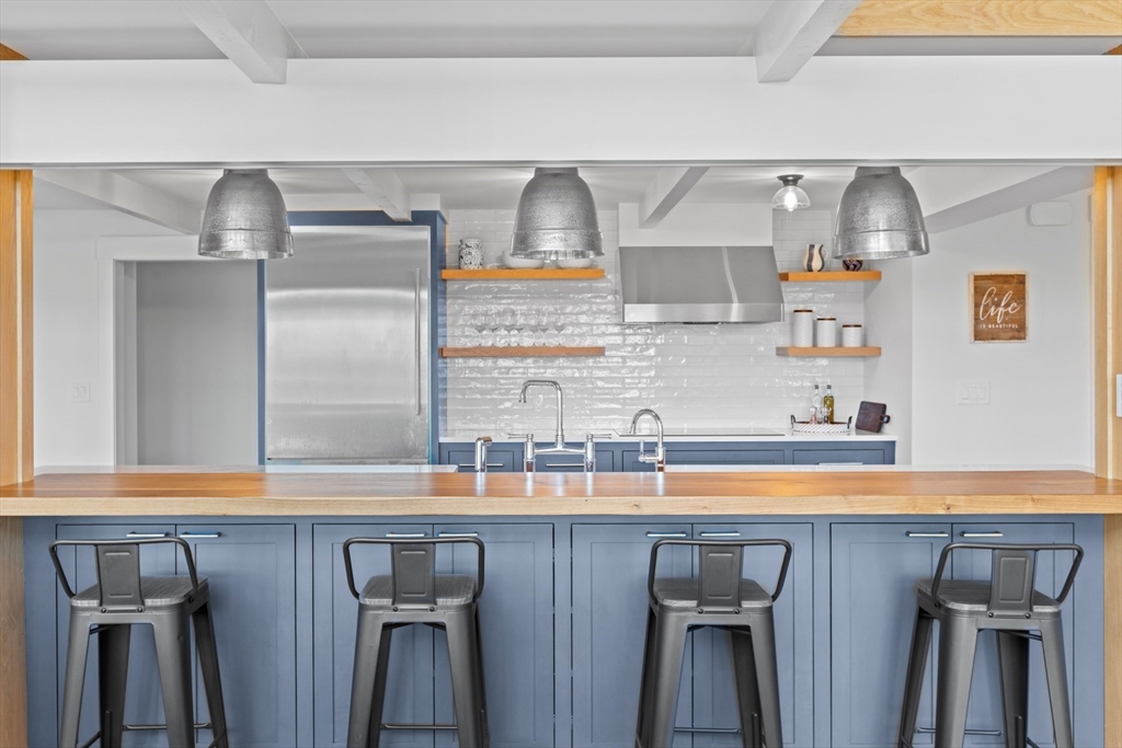 56 Hill Top Road Gloucester, MA 01930 - Photo 16 of 35 a kitchen with stainless steel appliances a sink and cabinets