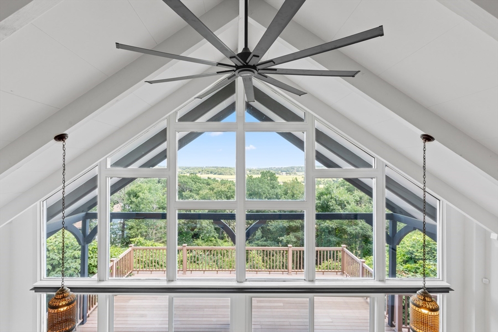 56 Hill Top Road Gloucester, MA 01930 - Photo 24 of 35 a view of a livingroom with a ceiling fan and a large window