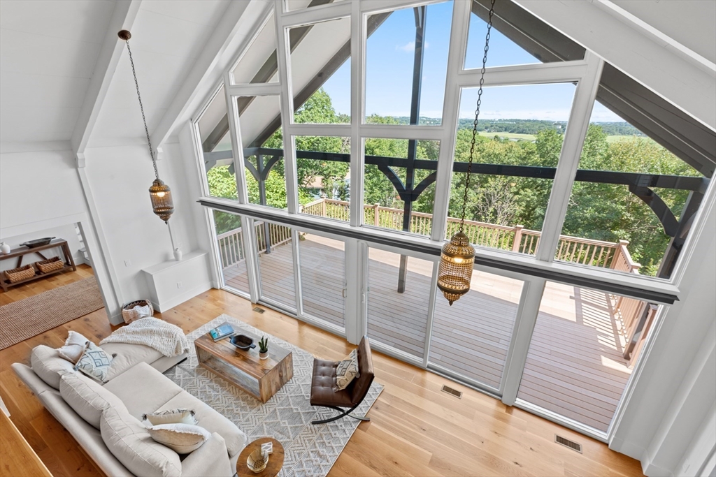 56 Hill Top Road Gloucester, MA 01930 - Photo 27 of 35 a view of living room with furniture and floor to ceiling windows