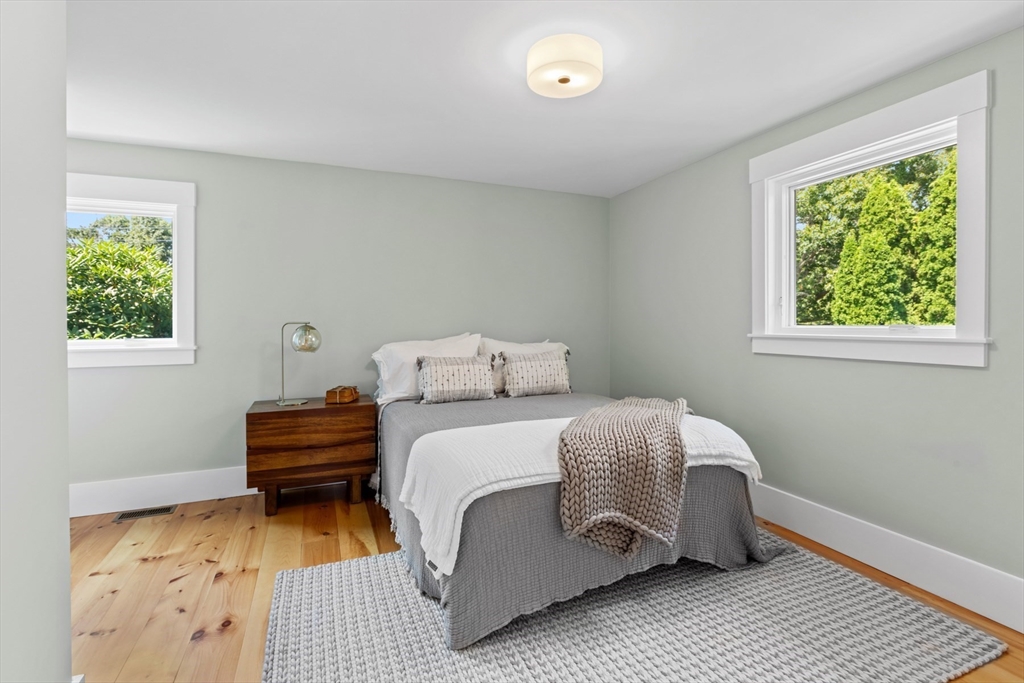 56 Hill Top Road Gloucester, MA 01930 - Photo 29 of 35 a bedroom with a bed lamp and a window
