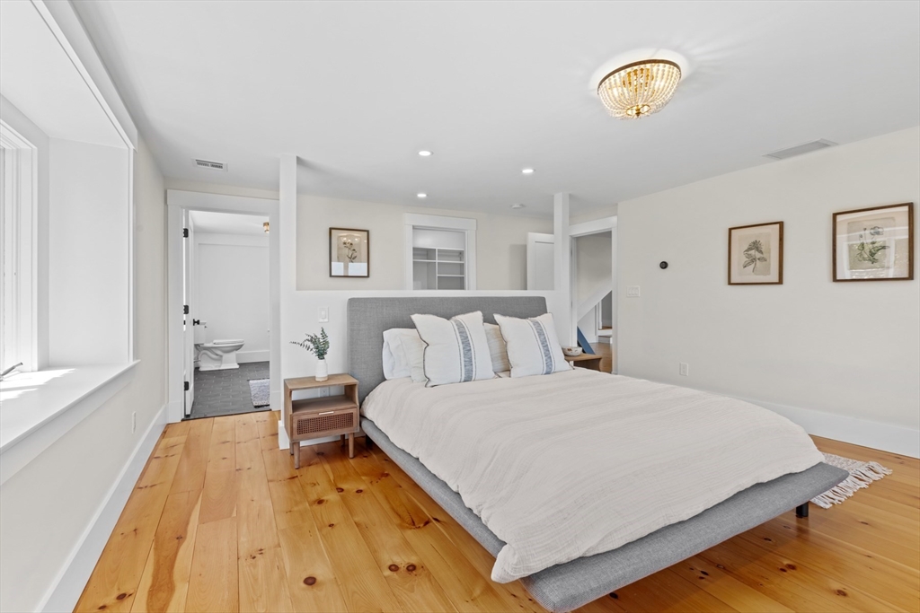 56 Hill Top Road Gloucester, MA 01930 - Photo 30 of 35 a spacious bedroom with a bed and a window