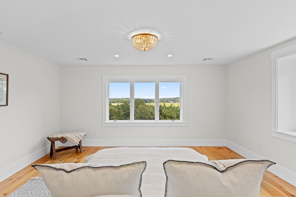 56 Hill Top Road Gloucester, MA 01930 - Photo 31 of 35 a bedroom with a bed and a window
