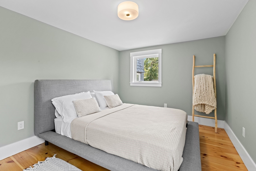 56 Hill Top Road Gloucester, MA 01930 - Photo 33 of 35 a bed sitting in a bedroom next to a window