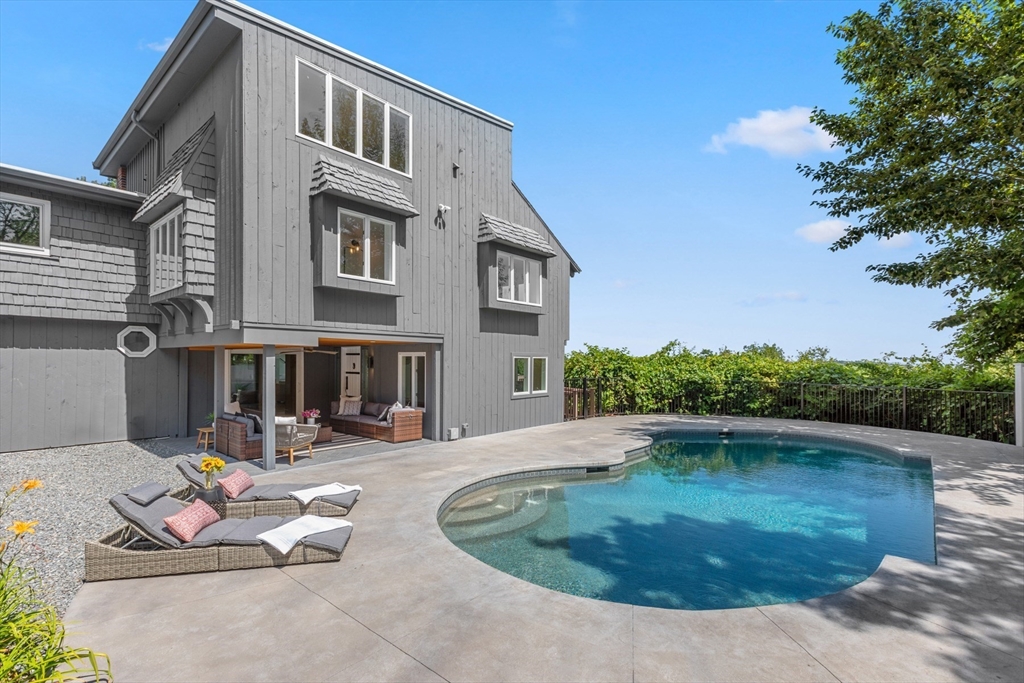 56 Hill Top Road Gloucester, MA 01930 - Photo 5 of 35 a view of a swimming pool with outdoor seating