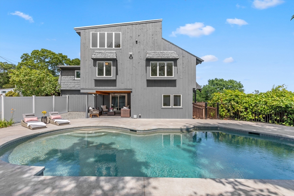 56 Hill Top Road Gloucester, MA 01930 - Photo 7 of 35 a backyard of a house with table and chairs