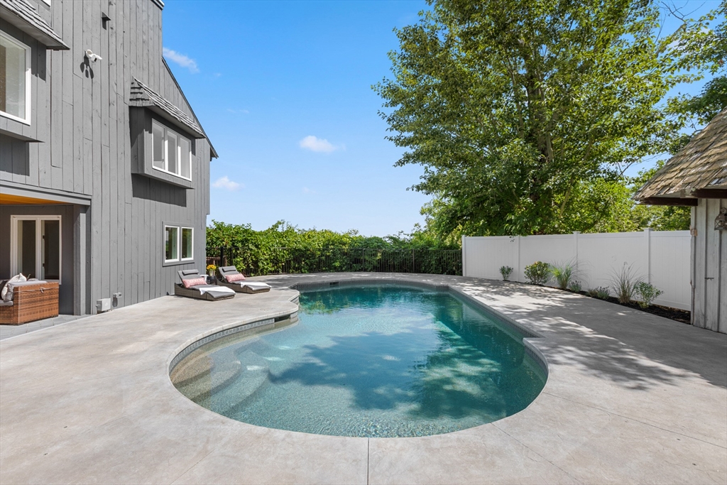 56 Hill Top Road Gloucester, MA 01930 - Photo 8 of 35 a view of a swimming pool with a yard