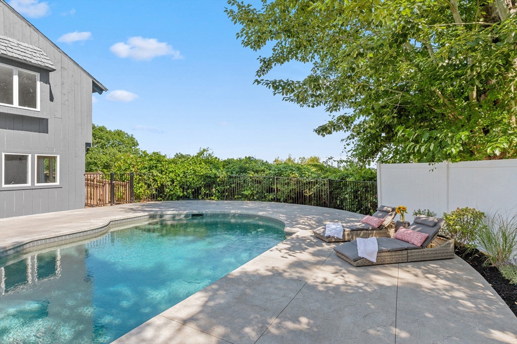 56 Hill Top Road Gloucester, MA 01930 - Photo 9 of 35 a view of backyard with outdoor seating and plants