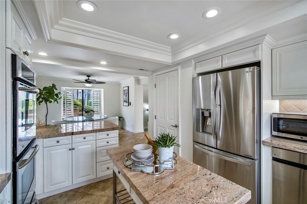 32041 Point Place Laguna Beach, CA 92651 - Photo 17 of 59 a kitchen with refrigerator and cabinets