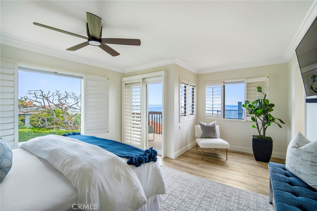 32041 Point Place Laguna Beach, CA 92651 - Photo 23 of 59 a bedroom with a balcony a bed and a couch
